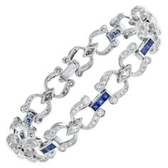 Handcrafted out of stunning French-cut blue sapphires and diamonds, this bracelet is perfect for evening or day wear. Each individual section features round diamonds and is separated from its neighbor with a sapphire line. This wonderful piece is a must-have for any Art Deco fanatic! Bracelet Information Metal: 18K White Gold Width: 9 mm. Length: 179 mm. Weight: 20.40 g. (approx. in total) Clasp: Push Clasp Gemstones I Type: Sapphire Shape: Square French Cut Size: 2.5 mm. Number: 24 Weight: 3.12 Carat (approx. in total) Gemstones II Type: Diamond Shape: Round Average Color: G Average Clarity: VS Size: 1.1 – 2 mm. Number: 136 Weight: 1.87 Carat (approx. in total) This bracelet will be made to your order in 1-2 weeks, contact us to find out more. An attractive bracelet box is included.  We d Square French, Sapphire And Diamond Earrings, Bracelet Box, White Gold Sapphire, French Cut, Estilo Art Deco, Art Deco Diamond, Sapphire Diamond, Diamond Shape