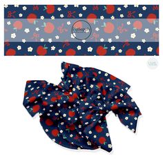 a blue bandana with red and white flowers on it, next to a box