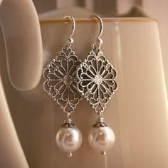 love these earrings Nickel Free Antique Silver Wedding Earrings, Antique Silver Nickel-free Earrings For Wedding, Nickel-free Antique Silver Earrings For Wedding, Nickel-free Antique Silver Wedding Earrings, Elegant Filigree Dangle Pearl Earrings, Antique Silver Wedding Earrings With Intricate Design, Silver Pearl Drop Earrings With Intricate Design, Handmade Silver Pearl Bridal Earrings, Elegant Antique Silver Jewelry For Wedding