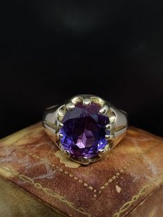 This beautiful 20th Century ring has great style featuring a large oval cut synthetic sapphire with slight colour change this stone features blue and purple but floureses vibrant orange under uv light. The gemstone is set in warm 9ct gold this gold has a slight Rosey tone common with items of this age.  UK size - Q US size - 8 Weight approx - 4.83 grams  Face length approx - 14.4 mm Message me any questions Classic Large Stone Amethyst Ring For Formal Events, Classic Formal Amethyst Ring With Large Stone, Classic Purple Gemstone Signet Ring, Classic Amethyst Signet Ring Hallmarked, Classic Amethyst Birthstone Ring, Classic Hallmarked Amethyst Signet Ring, Classic Purple Sapphire Ring With Prong Setting, Classic Purple Signet Ring For Anniversary, Classic Purple Birthstone Ring