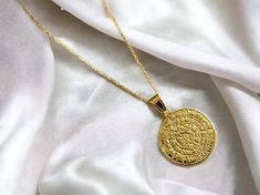 A gold disc of Phaestos charm necklace on a k14 solid gold chain. The ancient Greek calendar has hieroglyphics on both sides, in the form of a spiral, that have not yet been deciphered by archaeologists. K14 gold is used for the pendant and for the chain. A meaningful gift for a lover of historical artefacts. The actual disc is displayed in the museum of Herakleion on the Greek island of Crete. The gold necklace is delivered in a gift box. FREE  SHIPPING: Free international shipping with Fedex I Engraved 14k Gold Amulet Medallion Necklace, Symbolic Gold-plated Coin Necklace, Symbolic Engraved Yellow Gold Medallion Necklace, Symbolic Yellow Gold Coin Necklace, Engraved 14k Gold Amulet Coin Necklace, Symbolic Gold Coin Necklace, Spiritual Gold-plated Engraved Coin Necklace, Symbolic Yellow Gold Plated Coin Necklace, Symbolic Gold Engraved Coin Necklace