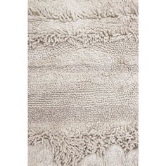 a white rug with fringes on it