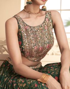 COLOR : Dark Green FABRIC : Top (Blouse) - Pure Georgette, Bottom (Lehenga) - Pure Georgette, Inner - Cancan, Dupatta - Chinon WORK : Thread Work, Beads, Stones, Sequins, Digital Print, Lace Border OCCASION : Wedding, Reception, Sangeet, Engagement READY-TO-WEAR : NoSTITCHING : Available as semi-stitched fabric, can be stitched using standard size option (+$30). Note: There might be a slight color variation due to lighting and flash used during photoshoot. The bright shade seen is the best close Sleeveless Traditional Wear With Intricate Embroidery For Weddings, Sleeveless Traditional Wear For Wedding With Intricate Embroidery, Semi-stitched Sleeveless Wedding Sets, Sleeveless Embroidered Wedding Lehenga, Sleeveless Georgette Choli For Wedding, Sleeveless Embroidered Sets For Wedding, Sleeveless Embroidered Wedding Sets, Wedding Choli With Floral Embroidery In Georgette, Sleeveless Wedding Choli With Resham Embroidery