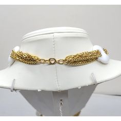 This is part of Chairish’s Costume Jewelry assortment.  Goldtone chains with white resin oval links with holes on either side necklace with spring ring clasp. Marked "NAPIER." Measures doubled: 14 inches by 2 1/8 inches wide. Interior circumference is about 29 inches.  Excellent condition. A similar necklace was featured in a 1974 advertisement. White Link Necklace With Gold Chain, White Gold Chain Link Jewelry, White Link Metal Jewelry, White Round Necklace With Gold Chain, White Necklace With Gold Chain, White Metal Jewelry With Chain, White Beaded Chain Choker Necklace, Elegant White Link Chain Necklace, Elegant White Chain Necklace With Chunky Chain