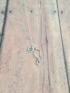 "This listing is for a necklace featuring a 4/5\" x 1/3\" sterling silver stethoscope charm & 3/10\" stainless steel initial pendant. The sterling silver chain is 18\" long. All items are lead & nickel free. Message me with any questions, thank you! Add an initial to any necklace: https://www.etsy.com/listing/170461597/add-an-initial?ref=shop_home_active&ga_search_query=Add Add a birthstone to any necklace: https://www.etsy.com/listing/170461853/add-a-birthstone?ref=shop_home_active& Adjustable Hypoallergenic Initial Pendant Jewelry, Adjustable Hypoallergenic Sterling Silver Charm Necklace, Adjustable Hypoallergenic Initial Pendant Charm Necklaces, Silver Adjustable Initial Necklace With Round Pendant, Adjustable Silver Initial Necklace With Round Pendant, Stethoscope Jewelry, Baptism Necklace, Godchild Gift, Stethoscope Necklaces