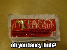 a packet of food that says fancy ketchup oh you fancy, huh?