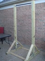 a wooden structure sitting in front of a brick wall