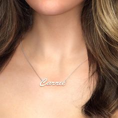 Sometimes, simple is best! This sterling silver classic name necklace is the perfect accessory to pair with almost everything, thanks to simple, delicate script that provides an elegant, feminine look. With room for up to nine characters, it’s ideal for celebrating anyone, and it’s also a wonderful design for keeping a favorite word that close to your heart.Chain Type: Width: 30 mmHeight: 15 mmThickness: 1.2 mmMaterial: Plating Color: Silver Classic White Gold Name Necklace, Classic Personalized Name Necklace, Classic Nameplate Necklaces, Classic White Gold Nameplate Necklace, Classic White Gold Necklaces With Custom Name, Elegant Sterling Silver Nameplate Initial Necklace, Elegant Sterling Silver Nameplate Necklace, Silver Signature Nameplate Necklace, Classic White Gold Custom Name Necklace