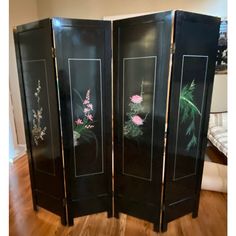 three panel screen with flowers painted on it