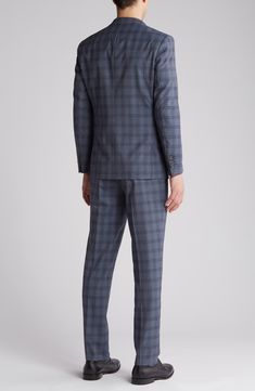 Sophisticated peaked lapels smarten the jacket of this trim-fit suit crafted from a fine wool blend and finished in a handsome windowpane plaid print. 36 1/4" inseam; 7 3/4" leg opening; 10 1/2" rise (size 38R) Jacket has peaked lapels; chest welt pocket; front flap pockets Unhemmed Lined 90% wool, 10% polyester Dry clean Imported Windowpane Plaid, Trim Fit, Fitted Suit, Plaid Print, Flap Pocket, Welt Pocket, Nordstrom Rack, Wool Blend, Two Piece