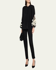 Kobi Halperin "Carlin" blouse with pintuck details, sheer sleeve inset, and 3D floral appliqué    V neckline; concealed button front    Selftie at the neckline    Long raglan blouson sleeves    Button cuffs    Relaxed fit    Silk    Dry clean    Imported Designer Long Sleeve Blouse With Blouson Sleeves, Designer Blouse With Blouson Sleeves, Luxury Long Sleeve Embellished Blouse, Luxury Blouse With Sheer Sleeves For Workwear, Elegant Embellished Tops For Workwear, Designer Long Sleeve Blouse For Evening, Feminine Blouse With Sheer Sleeves For Work, Designer Long Sleeve Spring Blouse, Elegant Embroidered Sleeve Top For Work