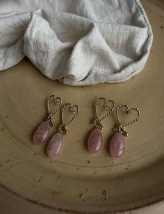 The heart-shaped design, crafted from gold-plated beaded wire, symbolizes the profound connection love brings. Soft pink rose quartz stones, renowned for their calming and loving energy, are thoughtfully chosen to inspire balance and peace within. Each pair is  handmade with care, ensuring a meaningful touch of love in your life. These earrings not only represent the crystal of eternal love but also support unconditional love in all aspects of life. Let the gentle energy of rose quartz open your Wire Rose, Loving Energy, Love Connection, Rose Quartz Earrings, Rose Quartz Stone, Chakra Balancing, Quartz Rose, Handmade Gold, Quartz Earrings