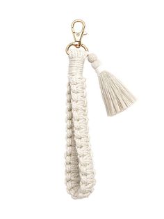 a white rope keychain with a tassel hanging from it's end