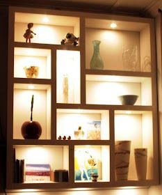 the shelves are filled with vases and other items