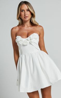 Angeletta Mini Dress - Sweetheart Rosette Detail Fit & Flare in White | Showpo Spring Mini Dress With Sweetheart Neckline And Lined Bodice, Flirty Mini Dress With Sweetheart Neckline And Fitted Bodice, Summer Wedding Mini Dress With Ruched Bodice, Flirty Spring Wedding Mini Dress, Sleeveless Flirty Wedding Corset Dress, Spring Wedding Mini Dress With Ruched Bodice, Flirty White Mini Dress With Boned Bodice, White Flirty Mini Dress With Boned Bodice, Flirty White Mini Corset Dress