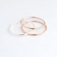 Minimalists rejoice over this dainty, sterling silver stacking ring. Smooth and shiny, made to order in your size! Any of our sterlings silver or gold stacking rings are just right for wearing alone, as a knuckle ring or as a set. This ring makes a lovely wedding band. This slim stacking band is also available in yellow gold or rose gold filled, or 14k solid yellow, rose or white gold (separate listings!). See additional links below for more metal options and ring styles. ►More stacking rings in Minimalist Stackable Round Midi Rings, Delicate Stackable Rings With Simple Design, Simple Stackable Midi Rings For Everyday, Simple Tiny Stackable Rings With Round Band, Simple Tiny Stackable Rings, Simple Rose Gold Midi Rings, Simple Stackable Promise Rings, Simple Open Stackable Rings, Delicate Rose Gold Minimalist Midi Rings