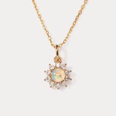 Elevate your everyday style with the timeless beauty of the Selenichast Opal Necklace. Designed for effortless elegance, this stunning necklace features a mesmerizing opal pendant that exudes a captivating play of colors. Its sleek and versatile design makes it the perfect accessory for any occasion, whether it's a casual outing or a formal affair. The high-quality craftsmanship ensures durability and longevity, allowing you to enjoy its beauty day after day. Make a statement with the Selenichas Fire Opal Jewelry Necklace, Elegant Ethiopian Opal Pendant Necklace, Elegant Ethiopian Opal Jewelry, Elegant Opal Clavicle Chain Jewelry, Elegant Opal Round Pendant Jewelry, Delicate Gold Opal Necklace, Elegant Round Opal Pendant Jewelry, Elegant Round Opal Necklace, Elegant Opal Gemstone Necklaces