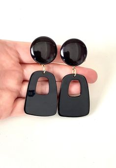 Clip on, black acrylic, drop style earrings from Olivia Divine. Large black, clip on top with abstract style acrylic drop. Lightweight. Length 7.5 cm approx . Handmade and unique design. Please take a look at my store https://www.etsy.com/uk/shop/Oliviadivine?ref=seller-platform-mcnav Bold Black Drop Earrings, Modern Black Earrings For Party, Black Resin Drop Earrings, Black Plastic Jewelry Gift, Black Resin Dangle Jewelry, Elegant Black Resin Earrings, Black Resin Party Jewelry, Turquoise Hoops, Black Acrylics