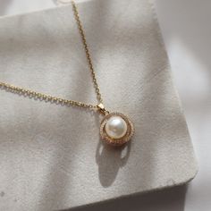 The Mae Pearl Necklace is a glamorous statement piece. Embellished with a pearl pendant, this necklace is perfect for any formal or elegant occasion. -stainless steel, gold plated-15" with 2" extender Gold-tone Pearl Necklace With Pearl Chain, Gold-tone Pearl Chain Necklace, Elegant Pearl Chain Necklace For Party, Chic Clavicle Chain Necklace For Weddings, Chic Wedding Clavicle Chain Necklace, Gold Chain Necklace With Pearl Pendant For Party, Party Gold Chain Necklace With Pearl Pendant, Metal Pearl Drop Necklace, Elegant Beaded Pearl Chain Necklace