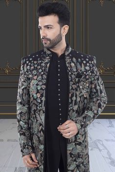 This Mens Sherwani (S2- S369) features colorful floral thread embroidery, giving it an elegant and sophisticated look. The open-jacket design adds a touch of modernity and versatility. Perfect for special occasions, this sherwani is sure to make a statement and elevate your style. Designer Sets With Floral Embroidery For Transitional Season, Bollywood Style Formal Outerwear For Eid, Designer Floral Embroidered Kurta For Reception, Designer Festive Outerwear With Dabka Detailing, Designer Festive Outerwear With Dabka, Designer Festive Outerwear With Dabka Embroidery, Designer Sherwani With Floral Embroidery For Eid, Festive Designer Sherwani With Floral Embroidery, Designer Floral Embroidered Traditional Sherwani