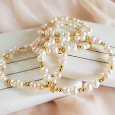 This bracelets are simple and cute! With pearls and gold beads that make them more charming. This bracelets are cooper plated and real pearls. Size: Stretch Color: White and Gold Material: Cooper Plated and Real Pearls Gold beads and pearls! Gold Pearl Bracelet, Real Pearls, Gold Pearl, Gold Beads, Gold Material, Pearl Bracelet, Pearl Necklace, Color White, Bangles