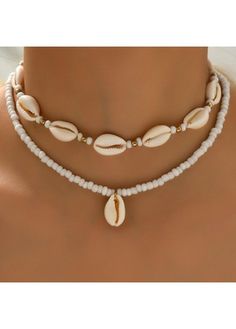 Color:White;Package Contents:2 X Necklace;Occasion:Sport; White Beaded Shell, White Pearl Beach Jewelry, White Pearl Jewelry For Beach, Elegant White Shell Necklace For Summer, White Pearl Jewelry For The Beach, Pearl Strand Beaded Necklaces For Beach, White Jewelry For Beach Season Gift, White Shell-shaped Shell Necklace, Handmade White Shells For Jewelry Making