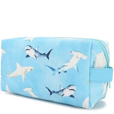 An adorable and square bag to hold all your essentials! Hold makeup, stationery, and more in this pouch and keep your bag organized! The Cosmetic Pouch Happy Sharks Blue is the perfect addition to your bag! Length: 8 inches Width: 4 inches Depth: 3 inches Weight: 0.4 lbs Material: Vegan Leather Rectangular Travel Pencil Case With Zipper, Trendy Rectangular Travel Pencil Case, Blue Large Capacity Pouch For Daily Use, Rectangular Zipper Pouch Cosmetic Bag For School, Blue Rectangular Case Bag For Daily Use, Blue Spacious Pouch For Daily Use, Trendy Blue Rectangular Case Bag, Large Capacity Rectangular Pencil Case For Travel, Blue Rectangular Daily Use Bag