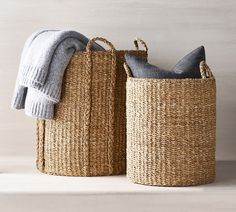 two woven baskets with towels in them