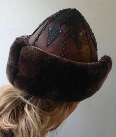 "Completely hand stitched Handmade This Leather hat is extremely thick and very warm.Made Genuine leather and Sheep Fur. Please be sure to measure the size of your head before buying. Measuring; Measuring for your head size is, You can use a tape measure (or a length of string that you will have to hold up to a tape measure) to determine the length. Place the string or tape around your head about 1/8\" above your ear, across the mid-forehead, completely circling your head. Hold the tape firmly, Traditional Handmade Costume Hats And Headpieces, Handmade Brimmed Bonnet, Handmade Brimmed Costume Hats And Headpieces For Festival, Handmade Brimmed Costume Hats For Festival, Vintage Handmade Brimmed Costume Hat, Handmade Brimmed Festival Costume Hats And Headpieces, Handmade Artisan Hat Bands For Winter, Handmade Short Brim Costume Hats For Festivals, Handmade Vintage Brimmed Costume Hats