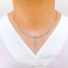 Radiant White Gold Diamond Necklace Set - the perfect addition to any sophisticated ensemble. Crafted from 18k white gold and weighing 24.1 grams, this piece features stunning round diamonds with a total weight of 2.96ct, set in a beautiful 17.5" necklace with a 1.25" drop length. It also comes with matching earrings with a length of 1.25" and screw backs for secure wearing. The lobster lock ensures this set stays safely in place, making it the perfect accessory for any occasion. PRODUCT DETAILS White Necklace With Hand Set Fine Jewelry, White Fine Jewelry Necklace With Hand-set Details, White Hand-set Necklace In Fine Jewelry Style, White Fine Jewelry Necklace, Elegant Diamond White Platinum Tennis Necklace, Exquisite White Diamond Necklace With Single Cut Diamonds, Elegant Silver Tennis Necklace With Single Cut Diamonds, Diamond White Platinum Bridal Necklace, Elegant Sterling Silver Tennis Necklace With Single Cut Diamonds