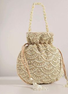 Color: Gold  Fabric: Raw silk Work: embroidery This pearl gold potli is a must in your wardrobe for a versatile style. Would go with anything and for any type of occasion. Potli Bags, Gold Fabric, Raw Silk, Versatile Style, Purses And Handbags, Gold Tones, Etsy Accessories, Accessory Gift, Gift Card