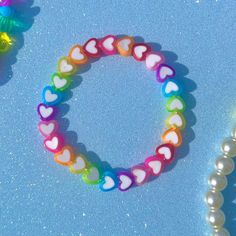 rainbow hearts beaded bracelet 🌈💘 ☁︎ details ☁︎  ❥ approximately 6.5 inches & super stretchy 🐛 ❥ can be adjusted to your sizing :) 🌈 ❥ want this same design but want it to say something else? i can do that 🍄 Bracelet Y2k, Hearts Bracelet, Disney Character Art, Trendy Bracelet, Wrist Stacks, Kandi Ideas, Pride Bracelet, Pride Day, Rainbow Hearts