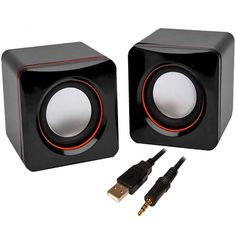 two black speakers with red trims and cables