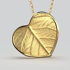 Elevate your style with our Italian 14k or 18k gold heart pendant and chain. Inspired by the beauty of nature, this exquisite heart pendant features a delicate leaf motif, infusing elegance and charm into every detail. Crafted with precision in Italy, this enchanting piece is a symbol of love and sophistication. A perfect accessory to cherish or to gift to someone special. 14k or 18k gold 20 mm high 20 mm large 18k Rolò chain chain length 45cm chain thickness 1.5mm designed and crafted in Italy Gold Heart Pendant Necklace Collectible, Elegant Yellow Gold Heart Pendant Charms, Gold-tone Heart Pendant Jewelry For Gift, Luxury Yellow Gold Heart Pendant, Yellow Gold Heart Pendant Charm Necklace, Fine Jewelry, Italian Gold Jewelry, Heart Pendant Gold, Italian Jewelry, Gold Heart Necklace