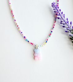 This super adorable gummy bear charm necklace is the perfect gift for any girls who love to accessorize with fun colorful beads!  How to order Just add to cart! The necklace has an extender so you can choose how long or short you like it! Please reach out with any questions! Playful Beaded Charm Necklaces For Gifts, Playful Beaded Charm Necklace For Gifts, Playful Beaded Charm Necklaces As Gifts, Playful Pink Charm Necklaces For Friendship, Playful Pink Charm Necklace For Friendship, Pink Kawaii Jewelry With Colorful Beads, Rainbow Kawaii Jewelry For Gift, Playful Heart Beads Necklace For Gift, Playful Heart Beads Necklace As Gift