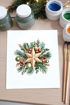 A watercolor Christmas card design featuring a star with pine branches, red berries, and ornaments for a festive touch. Bookmark Ideas, Pine Branches, Diy Notebook