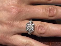 "The item is a sterling silver filigree diamond ring. The ring weighs 2.6 grams and is a finger size 7. The top part of the ring measures 11 millimeters wide and the bottom part of the ring measures 2 millimeters wide. The seven diamonds weigh .05 carats. The diamonds are a \"G\" color and \"SI2\" clarity. I can adjust the size on it . I will provide a ring box with the ring." Filigree Diamond Ring, Silver Diamond Ring, Sterling Silver Filigree, Silver Filigree, Silver Diamonds, Ring Box, Statement Rings, The Ring, Diamond Ring