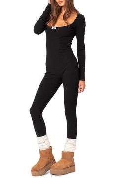 A stretchy ribbed design adds to the endless comfort of this cozy jumpsuit designed with long sleeves and a wide scoop neckline detailed with a dainty bow. Pull-on style Scoop neck Long sleeves 45% polyester, 45% rayon, 10% spandex Machine wash, dry flat Imported Stretch Ribbed Long Sleeve Bodysuit, Casual Long Sleeve Ribbed Bodysuit, Casual Ribbed High-stretch Jumpsuits And Rompers, Ribbed Stretch Bodysuit For Fall, Winter Loungewear Long Sleeve Jumpsuits And Rompers, Casual Stretch Bodysuit For Winter, Long Sleeve Bodysuit For Loungewear In Fall, Solid Bodysuit With Thumbholes For Fall, Winter Solid Ribbed Jumpsuits And Rompers