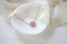 Beautifully detailed Rose gold CZ floral Bridal necklace is created with Rose Gold finish And premium cubic zirconia stones.Necklace measures 16 inches and extends to 18 inchesFlower measures 1/2" in diameterAvailable in two finishes, rose gold or rhodium (silver). FOR MATCHING PIECES SIMPLY TYPE "MORGAN" IN THE SEARCH BAR This is an original design by © Treasures by Agnes Bridal Backdrop, Gold Flower Necklace, Bridal Backdrops, Rose Gold Flower, Stones Necklace, Necklace Bridal, Cz Necklace, Necklace Wedding, Jewelry Crystal