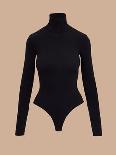 BOIndulge in the unparalleled elegance and comfort of the Classic Long Sleeve Turtleneck Bodysuit. Whether you're pairing it with a chic skirt for a sophisticated look or your favorite jeans for a casual yet refined ensemble, this versatile piece is your go-to wardrobe essential. Luxury Fabric:Crafted from a luxurious, high-stretch microfiber blend, this bodysuit offers a smooth, second-skin fit that moves with you. The fabric is machine washable, allowing for effortless maintenance and long-lasting wear. Advanced Craftsmanship:Designed with seamless construction, this bodysuit ensures a flawless, streamlined look. The high stretch and recovery of the fabric provide maximum comfort and flexibility, while superior body contouring enhances your natural silhouette. Universal Fit:The innovativ Kimono Pajamas, Chic Skirt, Turtleneck Bodysuit, Chic Skirts, Luxury Fabric, Lingerie Dress, Long Sleeve Turtleneck, Body Contouring, Women Supporting Women