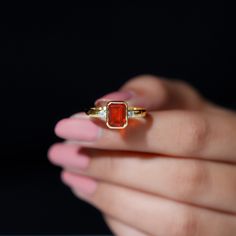 Product Details Adorn your better half with this phenomenal and elegant opal ring featuring an octagon-cut fire opal with Diamond stones on both sides, set in a bezel setting. This unique piece, made from solid gold, makes a wonderful gift for someone special. Product Information SKU SHP-RINGS0821230142 Width 8.5 mm Height 3 mm Weight 2.88 gm (Approximate) FIRE OPAL INFORMATION No.of Stones 1 Pieces Total Weight 1.00 Carat (Approximate) Dimension(approx) Emerald Cut-6X8 mm-1 Pcs Color Orange Cut Brilliant Shape Emerald Cut Setting Type Bezel Setting Quality Grade AAA DIAMOND INFORMATION No.of Stones 2 Pieces Total Weight 0.14 Carat (Approximate) Dimension(approx) Round-2.30X2.30 mm-2 Pcs Color HI Cut Brilliant Shape Round Setting Type Bezel Setting Quality Grade SI View More Product Parent Opal Solitaire Ring, Signature Jewelry, 18k Yellow Gold Ring, Gems Jewelry, Timeless Jewelry, October Birth Stone, Opal Gemstone, Diamond Stone, Opal Rings