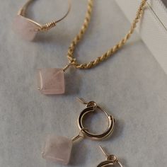 Normally a $212 value, get this square cut rose quartz set for a discounted bundle price of $155! Featuring all large square cut rose quarts gems, this jewelry set includes a simple ring, rope chain pendant necklace, and mini hoop huggie earrings only available in all high quality 14k gold filled material. Rose quartz is the ultimate gemstone of love. This crystal means more love is coming your way and the more love you receive the more you have to give :) Wire Wrapped Rose Gold Hoop Jewelry, Rose Gold Wire Wrapped Hoop Jewelry, Rectangular Rose Gold Sterling Silver Jewelry, Adjustable Gemstone Hoop Jewelry, Everyday Fine Jewelry With Rectangular Pendant, Fine Jewelry Everyday Rectangular Pendant, Pink Sterling Silver Jewelry, Tarnish Resistant, Everyday Fine Jewelry, Rectangular Shape, Fine Jewelry Rectangular Everyday Piece