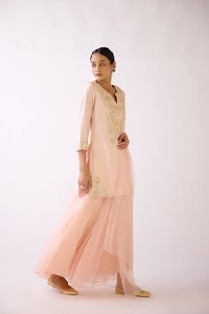 Stunning baby pink embroidered cotton silk sharara suit is a perfect festive wear. It comes with a matching dupatta. Shop online from Pure Elegance. Disclaimer: The actual product may vary slightly from the image. These are custom orders, hence expect slight variation in color and placement of the motif or buta. ESTIMATED DELIVERYBecause this is a custom order, it would take about 4 weeks from the date of purchase. RETURN POLICYThis product is a custom order and cannot be returned or exchanged. Peach Straight Kurta Set For Festive Occasion, Festive Peach Straight Kurta Set, Peach Sharara For Navratri Festivities, Festive Semi-stitched Peach Sharara, Festive Peach Sets With Chikankari Embroidery, Festive Peach Chikankari Embroidery Sets, Festive Peach Semi-stitched Sharara, Festive Peach Sets With Dori Work, Peach Sets With Dori Work For Diwali