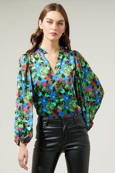 Add a pop of a colorful touch to your outfit of the day with the Destine Floral Hathaway Split Neck Long Sleeve Blouse! It features a ruffle split neckline framed by billowing balloon sleeves. The bodice maintains a relaxed fit and can be styled tucked into your favorite high waisted pants. This top is perfect for anything from day parties to dinner with friends.- Split neckline- Elastic cuffs - Lined- Balloon sleeves- Color: Green blue fuchsiaSize + Fit - Model is 5'8" and wearing size XS- Meas Bag Patches, Dinner With Friends, Balloon Sleeves, High Waisted Pants, Your Outfit, Outfit Of The Day, Sleeve Blouse, Fitness Models, Bodice