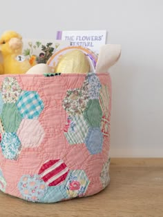 a pink basket filled with lots of different things