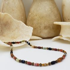 This necklace is even more beautiful in person! The detail and variances in color of the gemstone beading are really special and no two pieces of jewelry are the same. Banded agate and jade beads make up this 22-inch-long beaded necklace. The necklace has a s-hook closure. We will ship this jewelry with an information card. Designed and created by Museum Reproductions in the USA. For a matching bracelet visit this link: https://museumreproductions.etsy.com/listing/935740024 The extraordinary var Beaded Agate Crystal Necklaces With Round Beads, Agate Beaded Crystal Necklaces, Agate Beaded Crystal Necklaces With Round Beads, Bohemian Agate Beaded Necklaces With Gemstone Beads, Agate Jewelry With Oval Gemstone Beads, Agate Beaded Necklace With Faceted Beads As Gift, Oval Beaded Gemstones For Gifts, Adjustable Agate Beaded Necklace With Natural Stones, Handmade Agate Beaded Necklaces With Round Beads