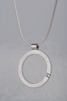 Are you looking for a gift idea for women? What would you say about this minimalist and delicate moonstone pendant necklace? Combination of this charming and delicate stone and rough, scratched silver surface makes the necklace look modern, but really subtle. Since moonstone is a June birthstone this necklace will be a great birthday gift for her. But it would also be a good choice if you are searching for an anniversary gift for your wife or girlfriend, or simply for yourself :) CHARACTERISTICS Minimalist Round Bezel Setting Necklace, Minimalist Necklace With Bezel Setting And Round Pendant, Modern Pendant Jewelry With Bezel Setting, Minimalist Hand Forged Moonstone Jewelry, Moonstone Round Pendant Jewelry For Anniversary, Minimalist Jewelry With Bezel Setting Round Pendant, Minimalist Pendant Jewelry With Bezel Setting, Modern Silver Gemstone Necklaces, Modern Sterling Silver Jewelry With Pearl Pendant