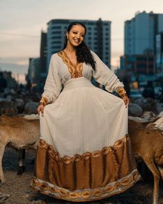 Golden Brown Shimena Beauty: A Gorgeous Habesha Dress with Menen Fabric and Tilf Chain Design, Habesha Kemis, Eritrean dress, ሀበሻ Traditional Gold Maxi Dress For Eid, Gold Floor-length Dress For Eid, Gold Anarkali Kaftan With Traditional Drape, Traditional Gold Gown With Dabka Details, Navratri Anarkali Dress With Gold Embroidery, Gold Maxi Length Dress For Eid, Ceremonial Dresses With Gold Embroidery For Festivals, Traditional Beige Floor-length Dress, Bollywood Style Dresses With Gold Embroidery For Navratri