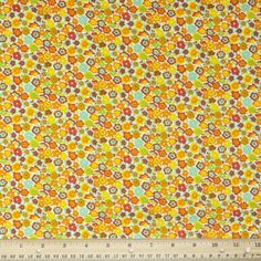 an orange and yellow floral print fabric