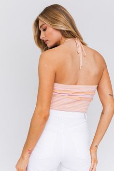 Radiate sunshine, summer and sweetness in this halter crop top! The perfect top for a concert, sunset dinner or a summer date night with your crush! We'd wear this beauty with denim shorts or white pants to complete the look. Add your favorite sandals or heels to be event-ready. Halter Neckline Ribbed Cropped Adjustable Tie Model is 5'9 and wearing a size S. Recommended Sizing. 2-4 S, 6 M, 8-10 L. Stretch Cotton Halter Top For Day Out, Casual Fitted Tank Top For Beach Party, Fitted Casual Tank Top For Beach Party, Flirty Cropped Tube Top For Summer, Fitted Tank Top For Spring Beach Party, Spring Halter Neck Top For Beach Party, Flirty Tube Top For Summer Vacation, Beachy Tube Top For Spring Vacation, Flirty Cropped Summer Crop Top